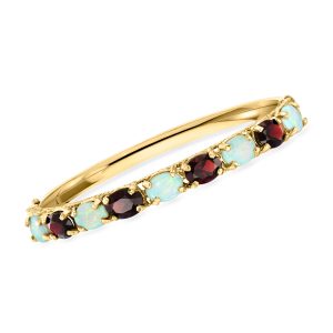 C. 1980 Vintage Opal and 5.20 ct. t.w. Garnet Bangle Bracelet in 14kt Yellow Gold. 7"