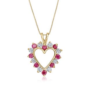 C. 1990 Vintage 1.20 ct. t.w. Ruby and 1.20 ct. t.w. White Sapphire Heart Pendant Necklace in 10kt Yellow Gold. 24"